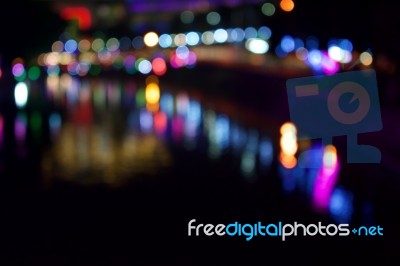 Without Objects, The City Lights And The Shadows In The Water Become The Background Stock Photo