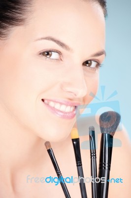 Woman And Make Up Brushes Stock Photo