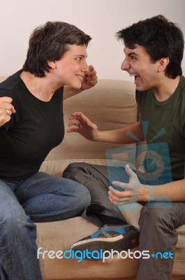 Woman And Man Yelling Face To Face Stock Photo