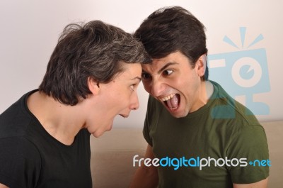 Woman And Man Yelling Face To Face Stock Photo