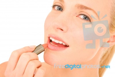 Woman Applying Lipstick Stock Photo