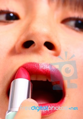 Woman Applying Lipstick Stock Photo