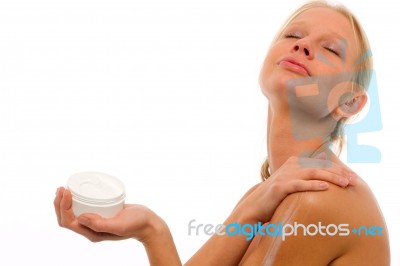 Woman Applying Moisturiser Stock Photo