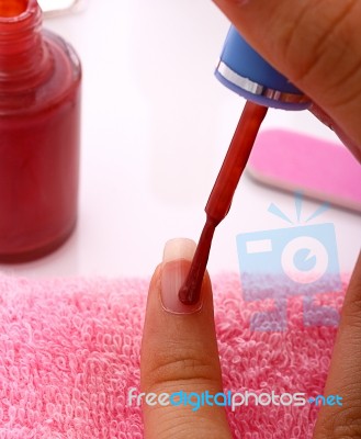 Woman Applying Nail Polish Stock Photo