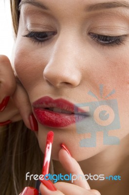 Woman Applying Red Lipstick Stock Photo