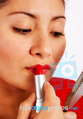 Woman Applying Red Lipstick Stock Photo