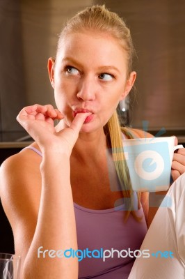 Woman At Home Having Breakfast Stock Photo