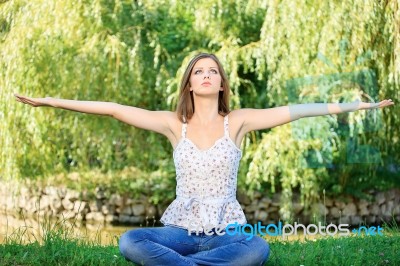 Woman At Meditation Outdoor Stock Photo