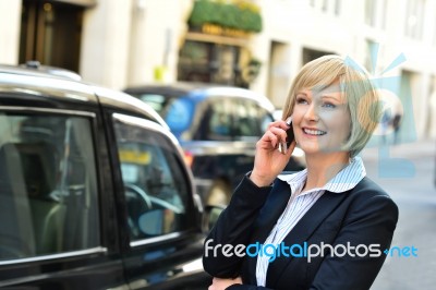 Woman Attending A Business Call Stock Photo