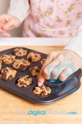 Woman Baking Chocolate Chip Muffin Closeup Stock Photo