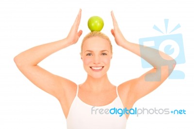 Woman Balancing Apple Stock Photo