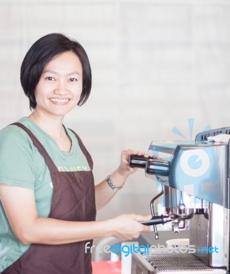 Woman Barista At Work In Coffee Shop Stock Photo