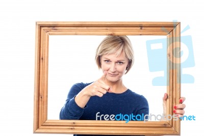 Woman Behind Wooden Frame Pointing  You Out Stock Photo