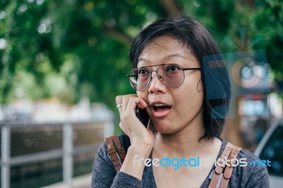 Woman Calling With Mobile Phone Disappointed On Somethings Stock Photo