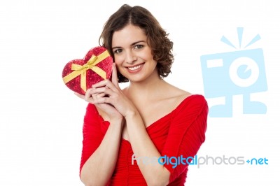 Woman Closely Holding Gift From Her Boyfriend Stock Photo