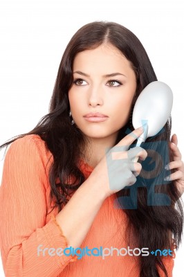 Woman Combing Her Hair Stock Photo