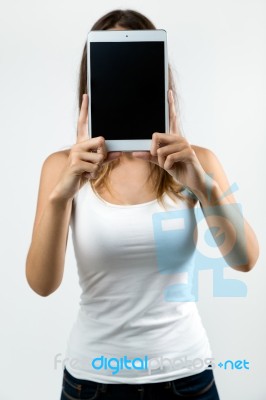 Woman Cover Her Face With Digital Tablet. Isolated On White Stock Photo