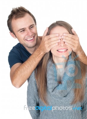 Woman Covering Her Lover's Eyes. Stock Photo