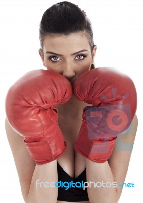 Woman Covering Her Mouth With Red Gloves Stock Photo