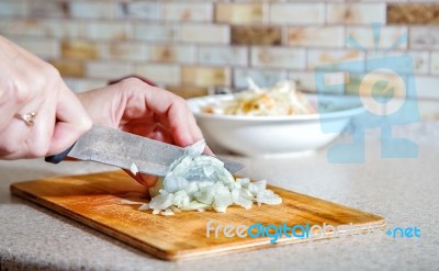 Woman Cuts Onion Stock Photo