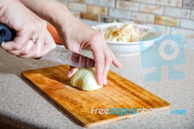 Woman Cuts Onion Stock Photo