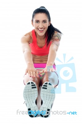 Woman Doing Stretching Exercise Stock Photo