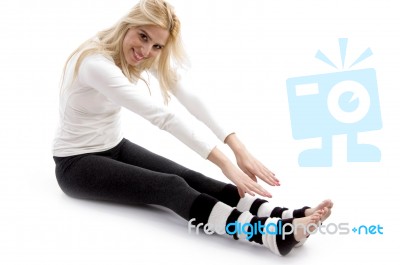 Woman Doing Stretching Exercise Stock Photo