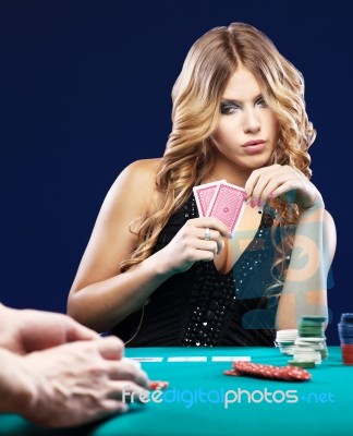 Woman Doubt In Gambling Match Stock Photo