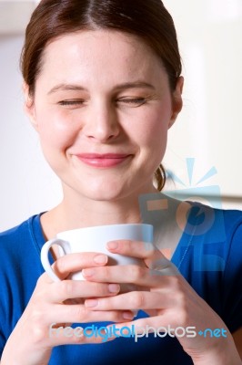 Woman Drinking A Cup Of Tea Stock Photo