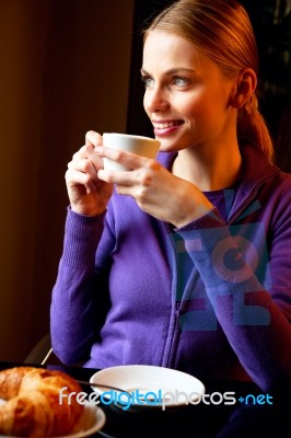 Woman Drinking Cappuccino Stock Photo