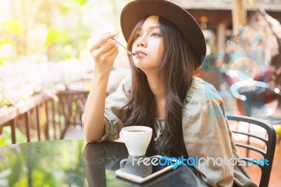 Woman Drinking Coffee In The Garden Outdoor In Sunlight Light En… Stock Photo