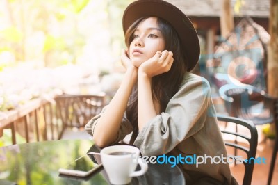 Woman Drinking Coffee In The Garden Outdoor In Sunlight Light En… Stock Photo