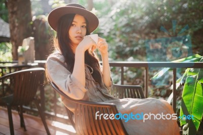 Woman Drinking Coffee In The Garden Outdoor In Sunlight Light En… Stock Photo