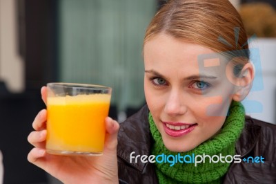 Woman Drinking Orange Juice Stock Photo