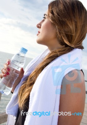 Woman Drinking Water After Sport Activities Stock Photo