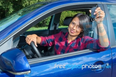 Woman Driving Car  Showing Car Key Stock Photo