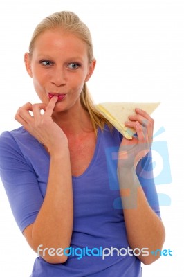 Woman Eating A Sandwitch Stock Photo