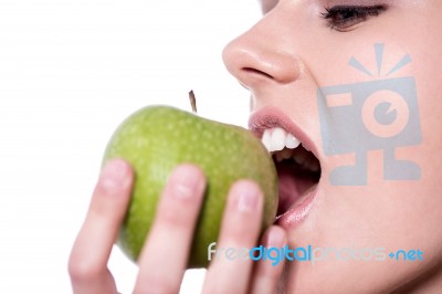 Woman Eating An Apple Stock Photo