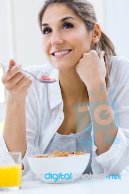 Woman Eating Cereals In The Morning Stock Photo