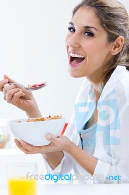 Woman Eating Cereals In The Morning Stock Photo