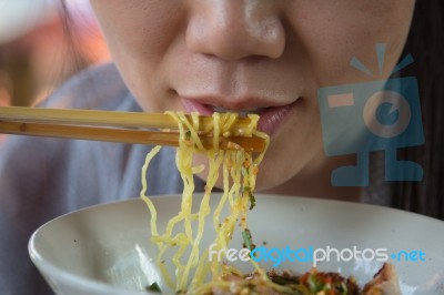 Woman Eating Noodles Stock Photo