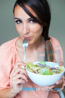 Woman Eating Salad. Portrait Of Beautiful Smiling And Happy Cauc… Stock Photo