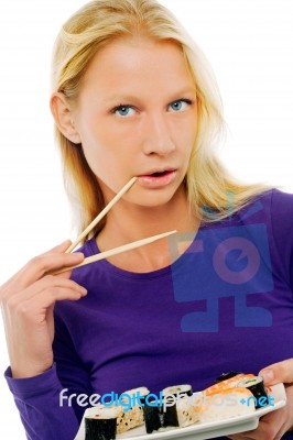 Woman Eating Sushi Stock Photo