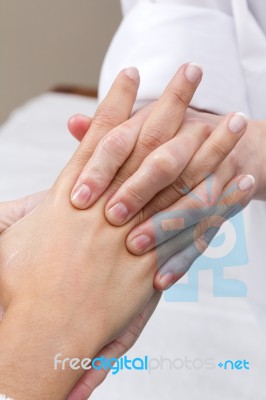 Woman Enjoying Hand Massage At Beauty Spa Stock Photo