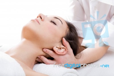 Woman Enjoying Massage At Beauty Spa Stock Photo