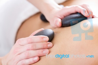 Woman Enjoying Massage At Beauty Spa Stock Photo