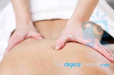 Woman Enjoying Shoulder Massage At Beauty Spa Stock Photo