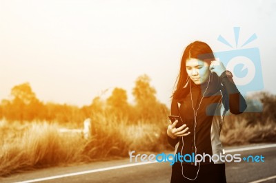 Woman Exercising Outdoor At Sunset  Stock Photo