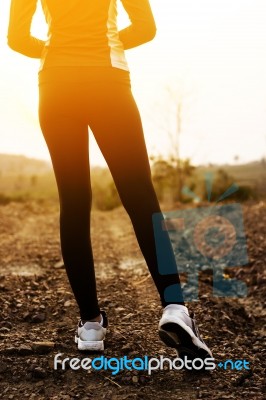 Woman Exercising Outdoor At Sunset  Stock Photo