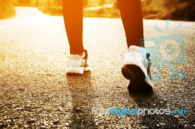 Woman Exercising Outdoor At Sunset  Stock Photo